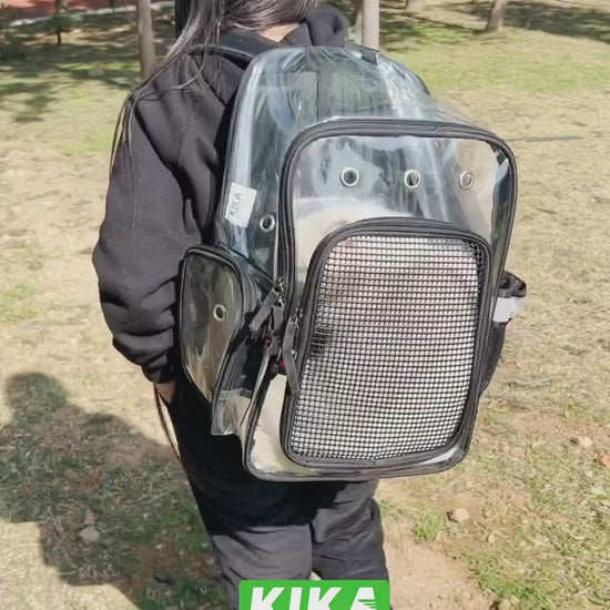 KIKA Pets CLEAR dog cat backpack carrier being carried by a model outdoors in a park, restaurant with showing cat in the bag